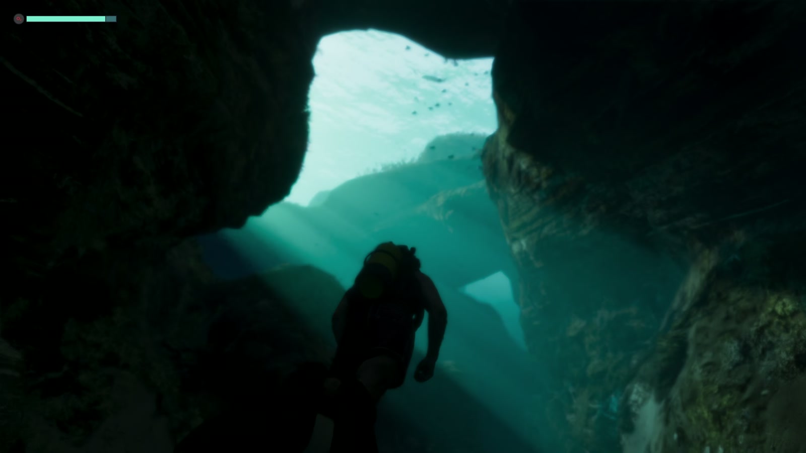 Personaje buceando entre rocas con equipo de oxígeno